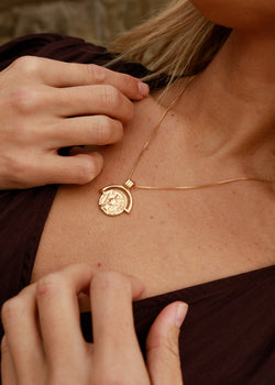 gold coin statement necklace with warrior coin details 