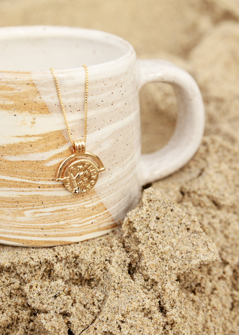 gold coin statement necklace with warrior coin details 
