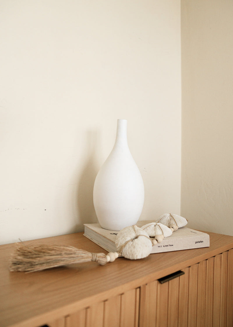 white ceramic thin neck vase