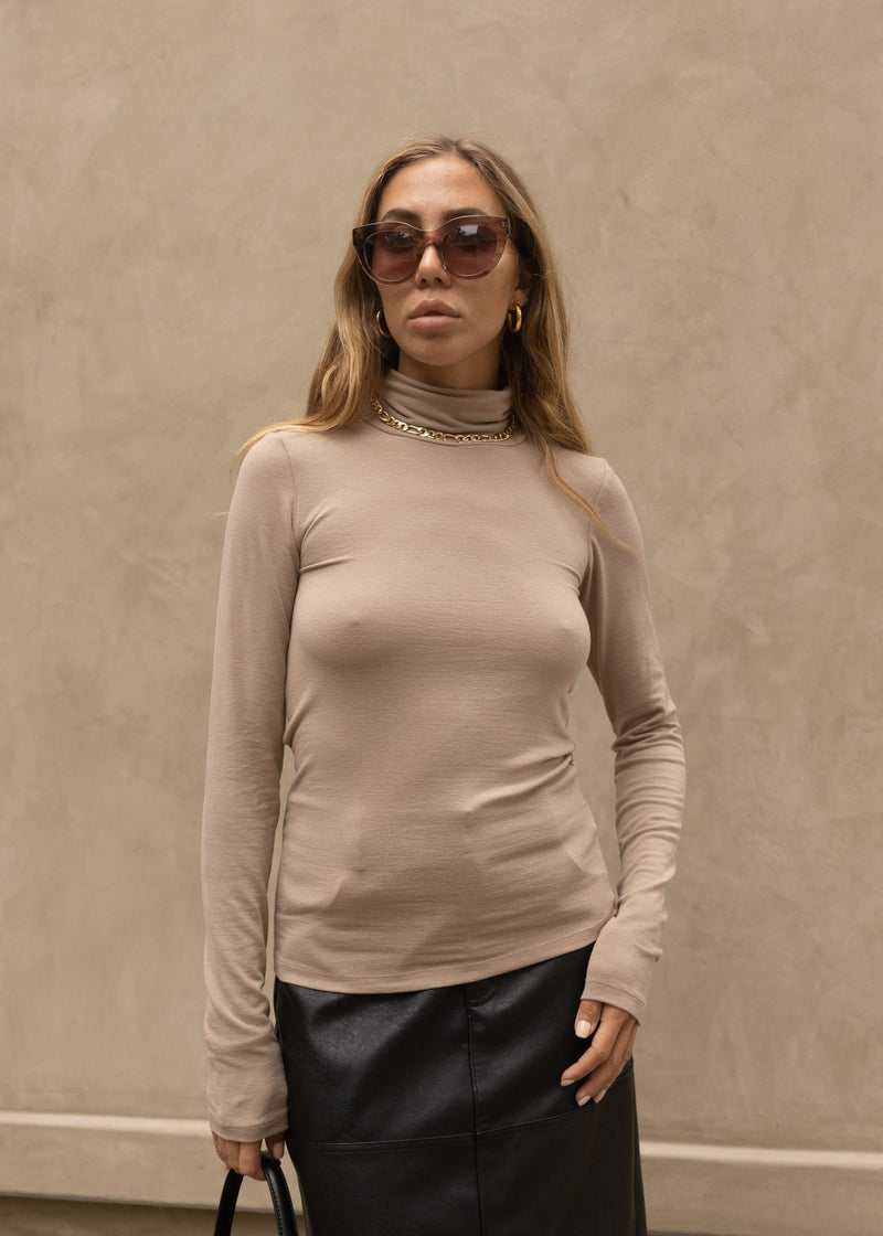 neutral taupe turtleneck layering top